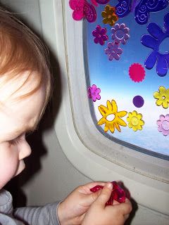 Toddler playing with window clings